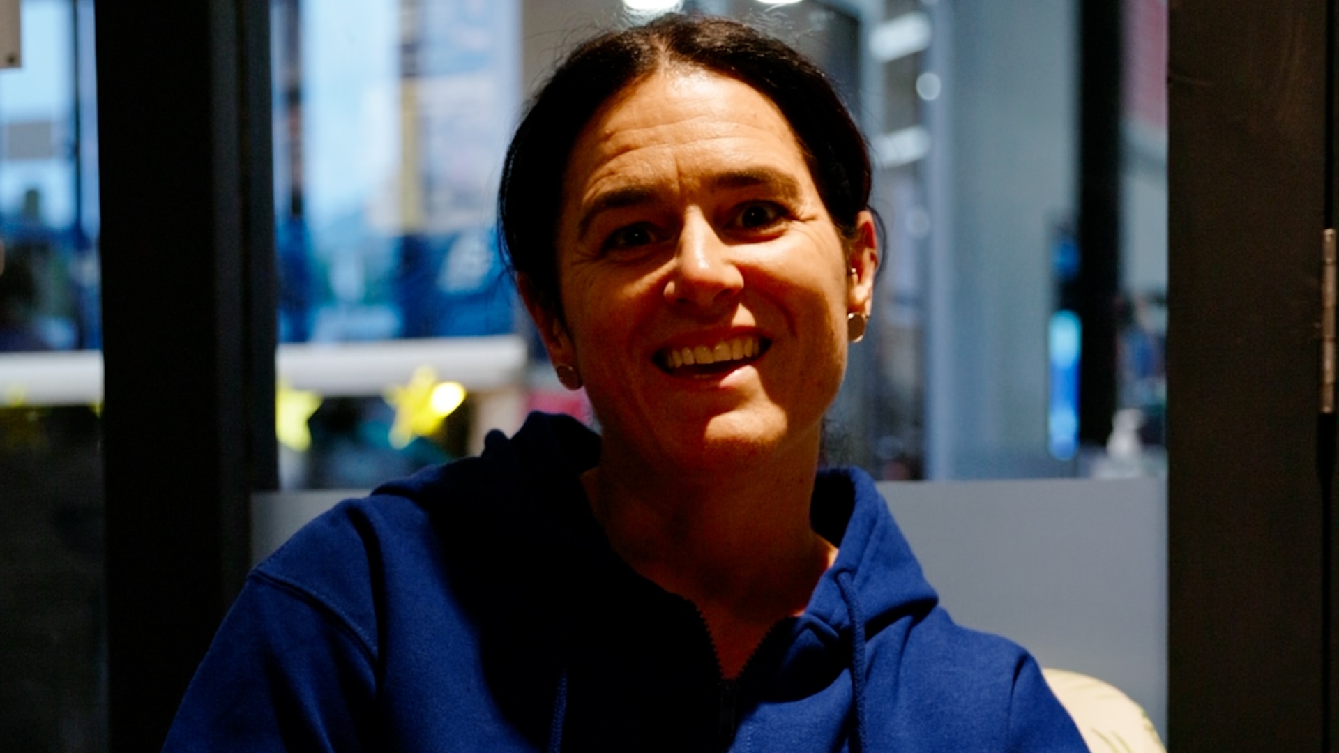 Stacey, a welcoming front-line team member at Genesis Ballarat, smiling as she shares her personal fitness journey and dedication to helping others feel at home in the gym